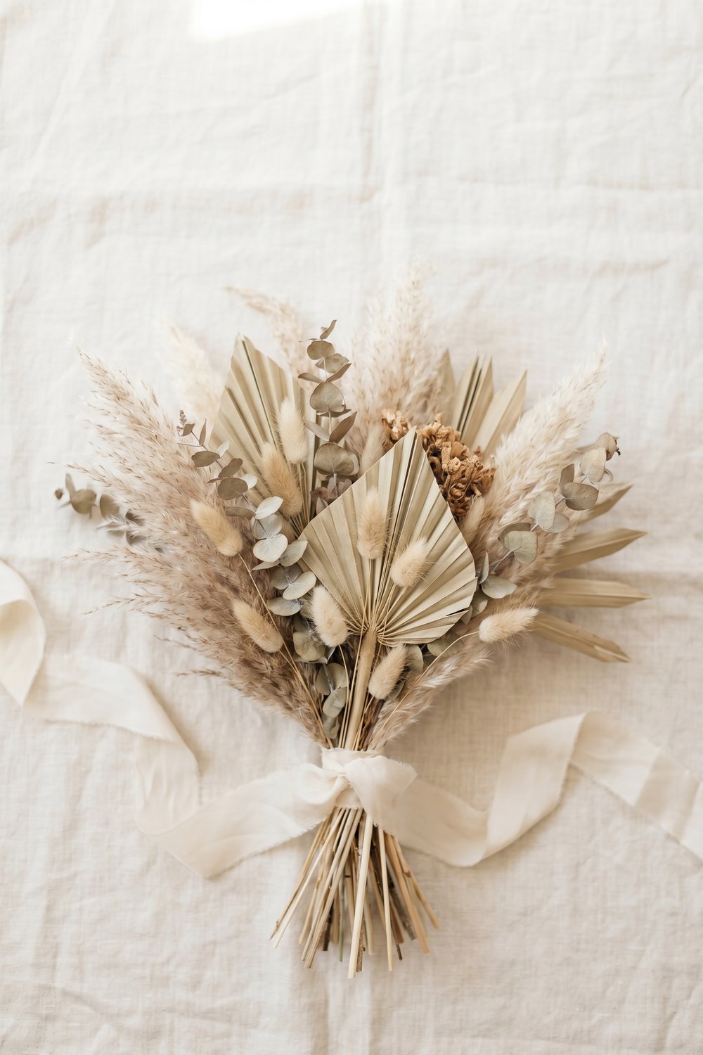 DIY dried floral bridal bouquet with pampas and palm